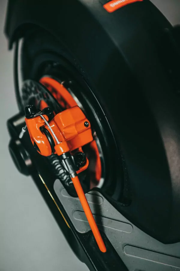 Inmotion Climber Electric Scooter rear brake calliper on a grey background