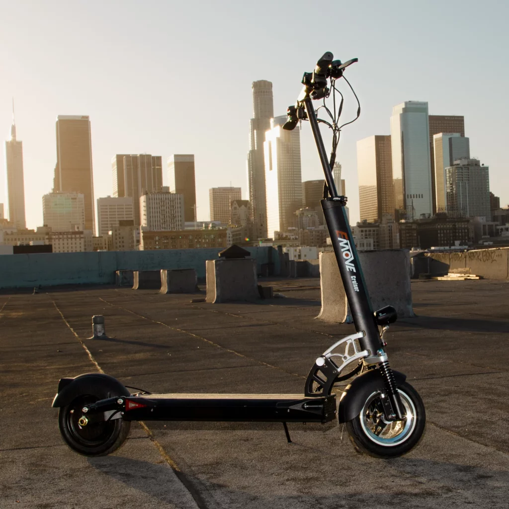 Emove Cruiser Electric Scooter in black with a city scape