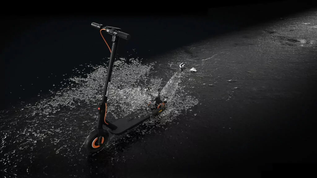 Inmotion Climber Electric Scooter pictured from above on a dark background and showing it moving through water